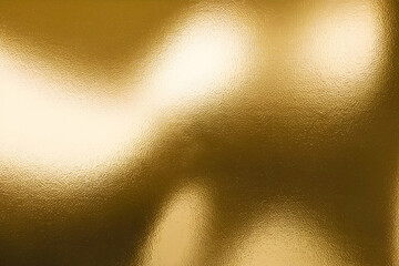 A soft, abstract golden surface with blurred light reflections creating a warm, luminous effect.