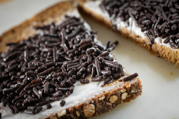 Slice of bread with hagelslaag. Typical Dutch bread breakfast topping