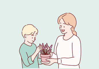 Cute child boy helping her mother to care for plants. Hand drawn style vector design illustrations.