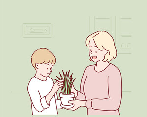 Cute child boy helping her mother to care for plants. Hand drawn style vector design illustrations.