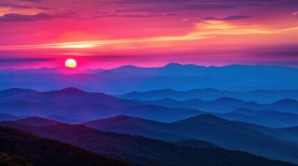 Fototapeta premium A sunset over the mountains, showcasing the breathtaking colors of the sky