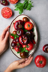 High-resolution image of fresh, juicy red tomatoes with water droplets on a clean background. This photo is perfect for promoting organic produce, healthy food, or farm-to-table concepts. 