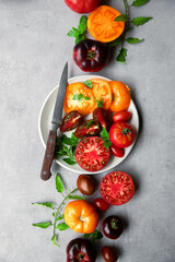 High-resolution image of fresh, juicy red tomatoes with water droplets on a clean background. This photo is perfect for promoting organic produce, healthy food, or farm-to-table concepts. 