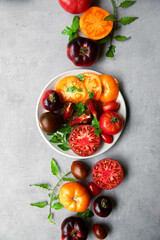 High-resolution image of fresh, juicy red tomatoes with water droplets on a clean background. This photo is perfect for promoting organic produce, healthy food, or farm-to-table concepts. 