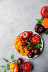 High-resolution image of fresh, juicy red tomatoes with water droplets on a clean background. This photo is perfect for promoting organic produce, healthy food, or farm-to-table concepts. 