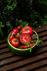 High-resolution image of fresh, juicy red tomatoes with water droplets on a clean background. This photo is perfect for promoting organic produce, healthy food, or farm-to-table concepts. 
