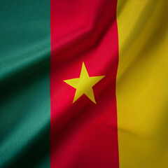 Naklejka premium Republic of Cameroon flag waving in the wind. Cloth fabric texture ensign background. Use it for national day and country occasions concept