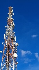Large network transmitter tower with clear sky in the background