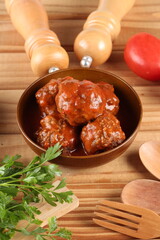 meatballs with tomato sauce and decorated with parsley