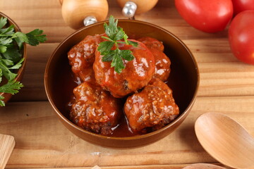 meatballs with tomato sauce and decorated with parsley