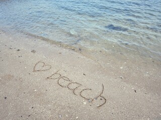 Hearts drawn on sand beach