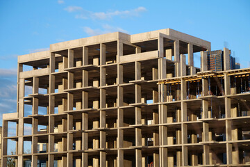 Frame of unfinished concrete construction of house, cast concrete structure