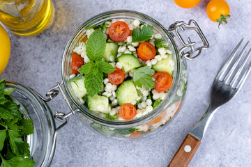 Tabbouleh salad national traditional food middle eastern. Healthy vegetarian food. Muslim family dinner, Ramadan, iftar. Arabian cuisine. top view