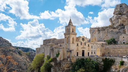 Fototapeta premium Enchanting Matera in Puglia, Italy, showcases stunning architecture against a vibrant blue sky
