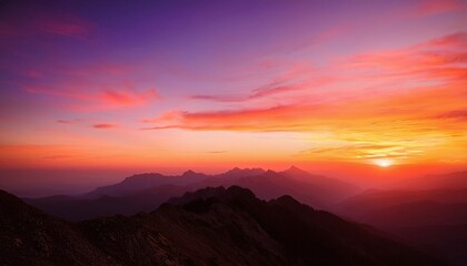Dramatic Sunset Casting Silhouettes Over Majestic Mountains