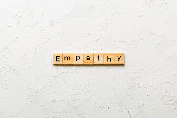 empathy word written on wood block. empathy text on table, concept