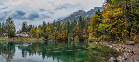 Blausee Switzerland, nature landscape at blue lake in autumn season