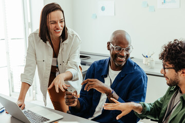 Diverse co-workers in a collaborative discussion during an office meeting
