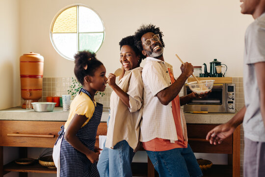 Family bonding in the kitchen: Mixing flour and making memories