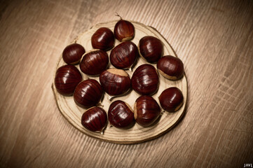 Chestnuts freshly picked in autumn in Candelario, presented on wood, still life