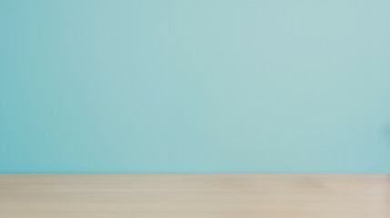 Minimalistic setup with a teal wall and light wooden table. Ideal for use in interior design, background, or modern decor projects.