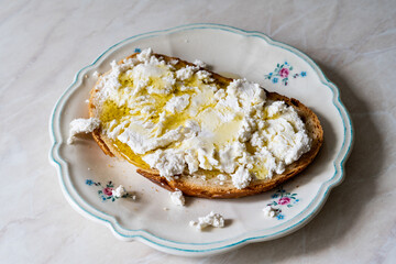 Turkish Lor Cheese with Olive Oil on Bread.