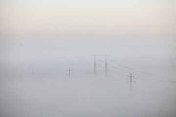 Electric towers in the strong fog