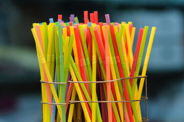 Multi-colored, plastic disposable drinking straws with bellows.