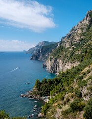 Fototapeta premium Stunning view of Amalfi Coast cliffs meeting the vibrant blue waters of Italy's Mediterranean Sea