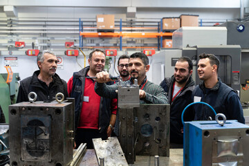 Males Industrial Engineers in Discuss New Project or planning investment project working and strategy. business making conversation at Industrial injection molding factory concept.