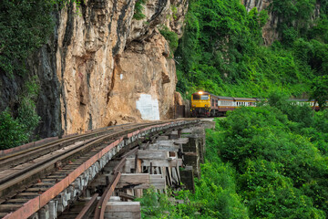 Trains running on death railways track crossing kwai river in kanchanaburi thailand this railways important destination of world war II history builted by soldier prisoners