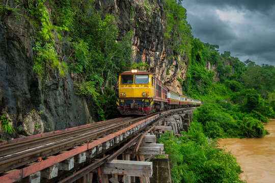 Trains running on death railways track crossing kwai river in kanchanaburi thailand this railways important destination of world war II history builted by soldier prisoners