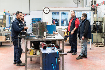 Males Industrial Engineers in Discuss New Project or planning investment project working and...