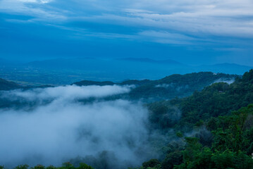 Beautiful Mountain landscape foggy windy mountain range green landscape asian farm. Amazing Landscape mountain green field meadow white cloud blue sky on sunrise. Countryside sunlight heaven scenery