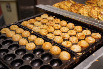 Takoyaki is a Japanese dish made by putting octopus in a flour batter and baking it