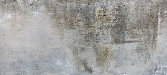 Rustic Worn Concrete Wall with Subtle Cracks and Texture. A rustic concrete wall with visible cracks and weathered texture, ideal for industrial backgrounds