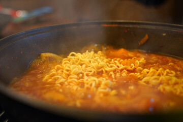 Add instant ramen to the kimchi stew broth and boil