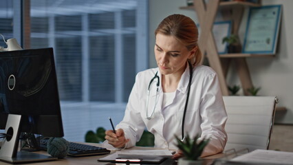 Healthcare worker talking computer consulting online. Closeup smiling doctor