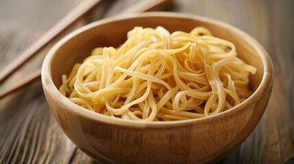 Noodles in wooden bowl. Closeup of cooked noodles in a wooden bowl, representing simplicity and nourishment.