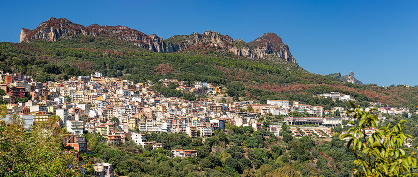 Cityscape of old pictoresque colorful town Jerzu with mountains and green forest vegetation. Province of Nuoro, Sardinia, Italy, Europe