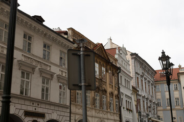 A stunning and picturesque view showcasing elegant Europeanstyle buildings lining a street under a cloudy sky