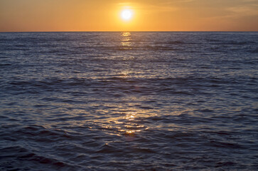 Soft orange sunset over the sea. Stylish background suitable for text and titles.