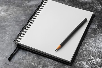 A Blank Canvas: Ready for Creativity with a Spiral Notebook and Pencil