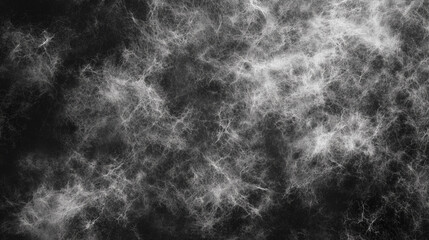 Abstract dark texture with wispy white patterns resembling fog or smoke in a moody setting