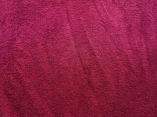 Magenta shower towel texture. Fluffy carpet background. Blank bathroom textile. Warm sweater natural material. Soft baby fabric backdrop detail. Magenta flat surface