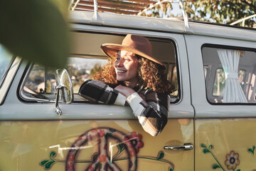 Woman Relaxing by Camper Van in the Afternoon Sun
