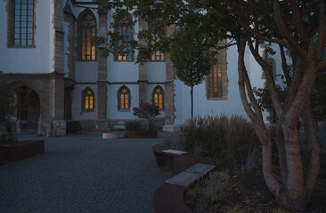 Church windows lightened  in the park blue hour.