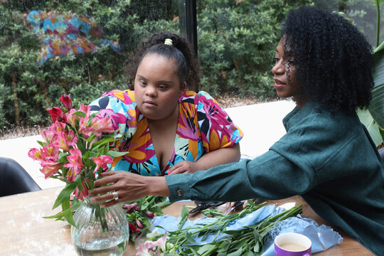 Women making flower bouquets during workshops