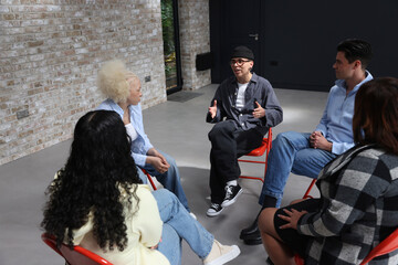 People talking during group therapy