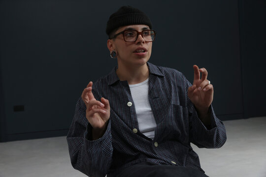 Person talking and gesturing